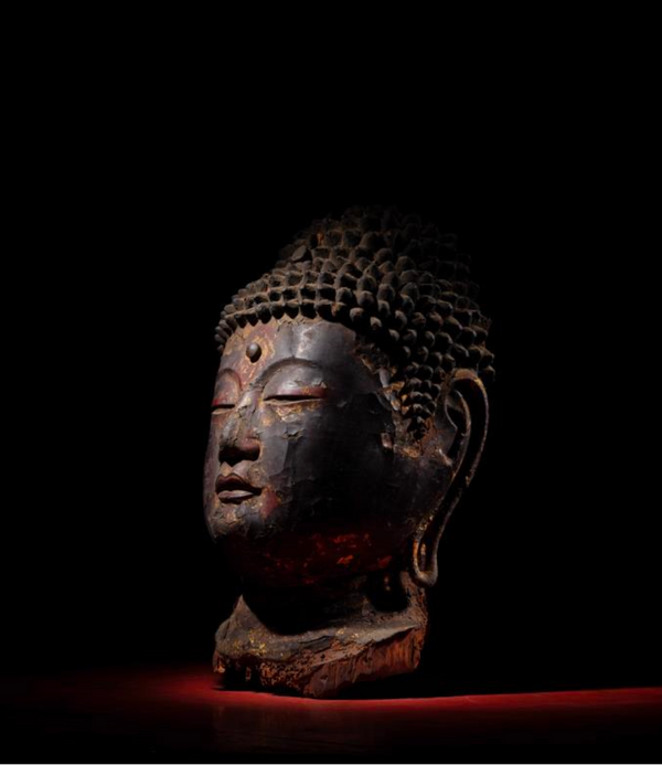 Gold and black lacquered head of Buddha, 8th to 12th century